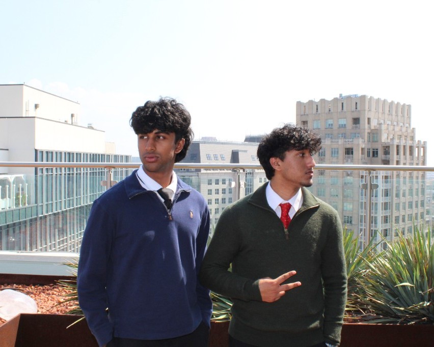 Two people on a rooftop.